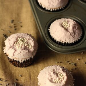 Hummingbird Bakery lavender cupcakes in a pan and on a counter