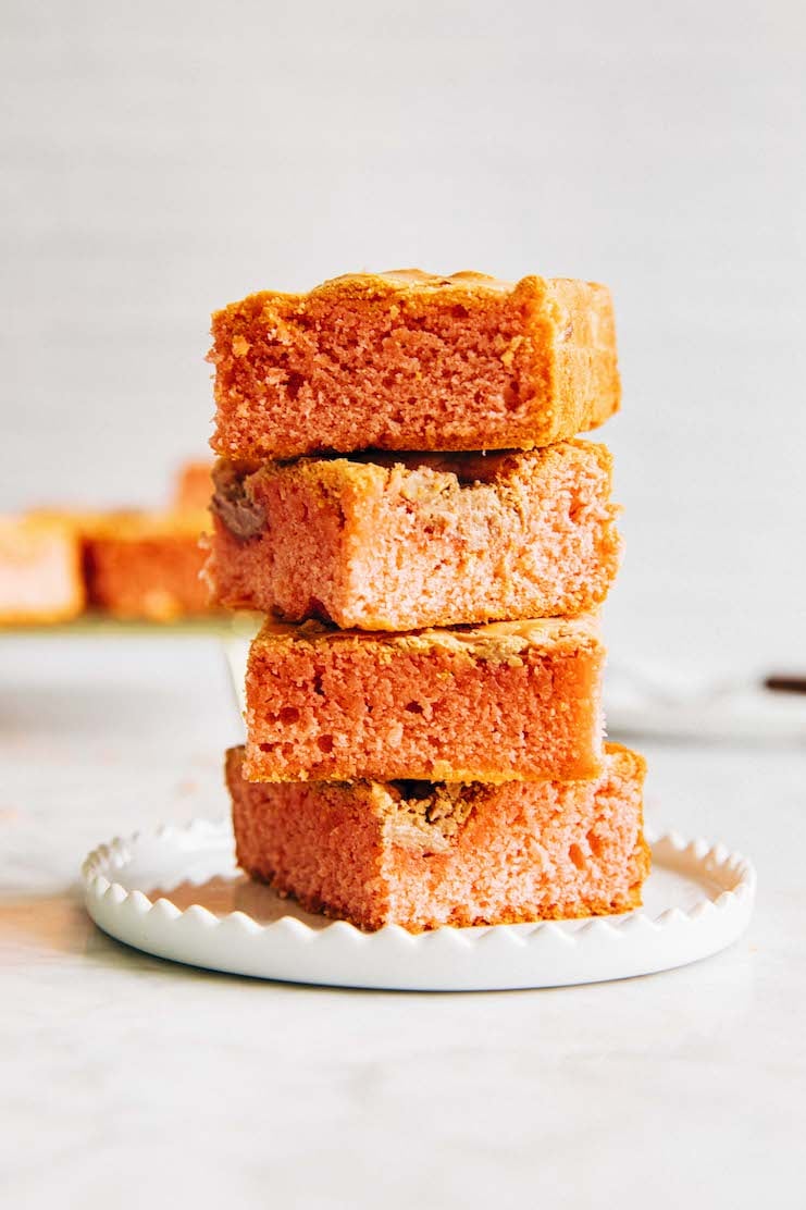 photo of blondies stacked on a white plate