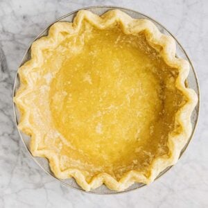 photo of pre baked pie crust on marble tabletop