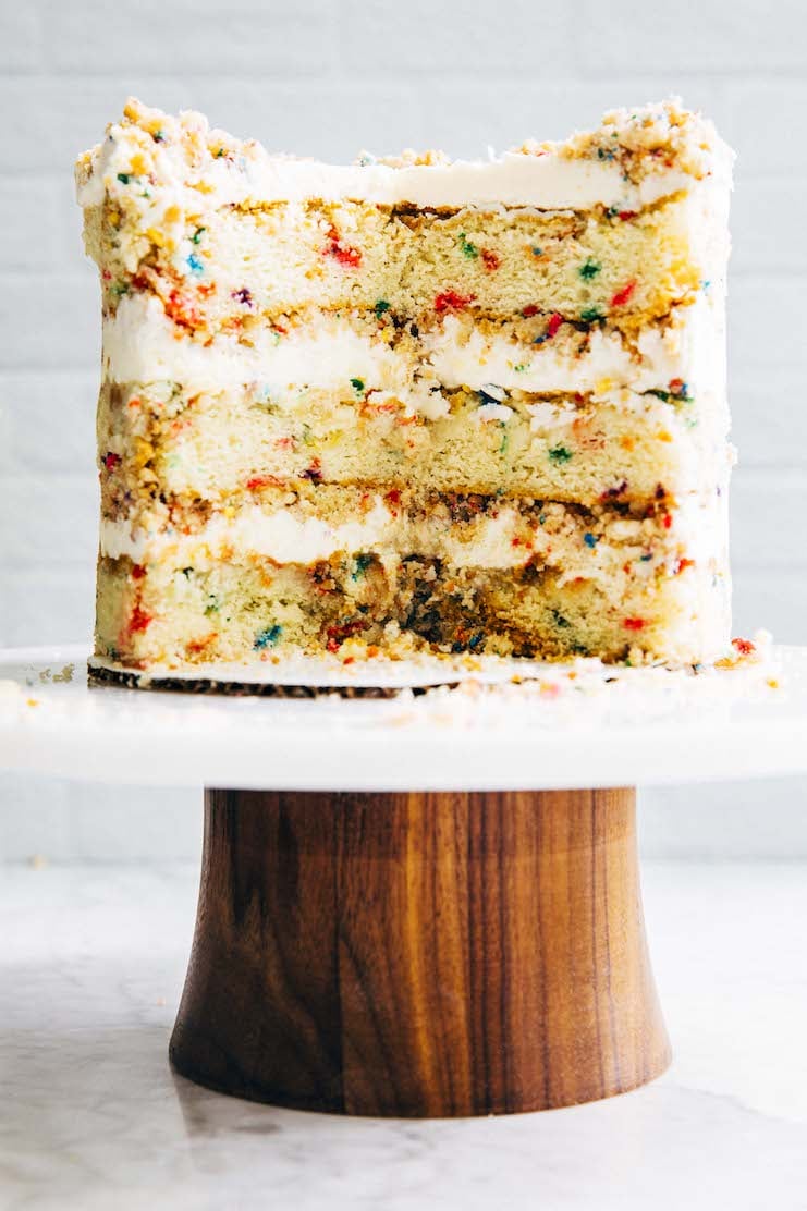 photo of sliced milk bar birthday cake on cake stand
