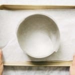 photo of cake ring lined with acetate on sheet pan