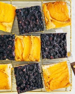 slices of upside down cake on a gold wire rack