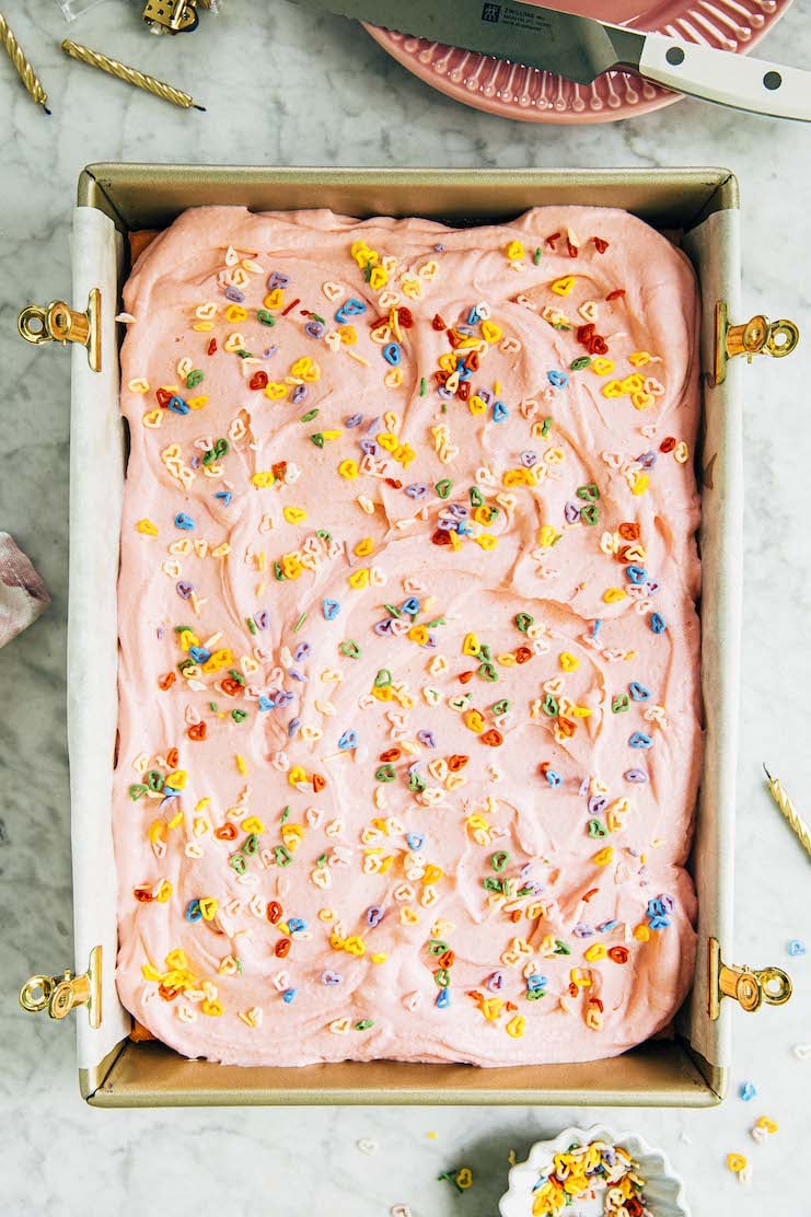 photo of pink sheet cake with heart shaped sprinkles