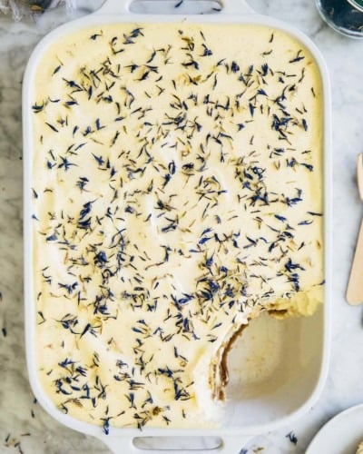 photo of earl grey tiramisu in a white casserole dish with a scoop taken out