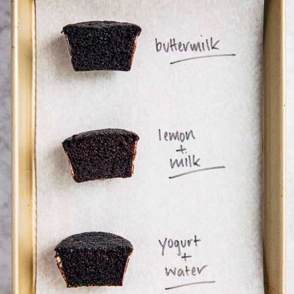 a photo of three chocolate cupcakes made with different buttermilk substitutes sliced crosswise