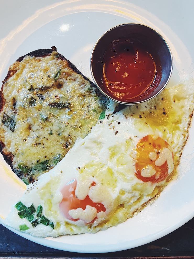 dishoom chili cheese eggs on white plate