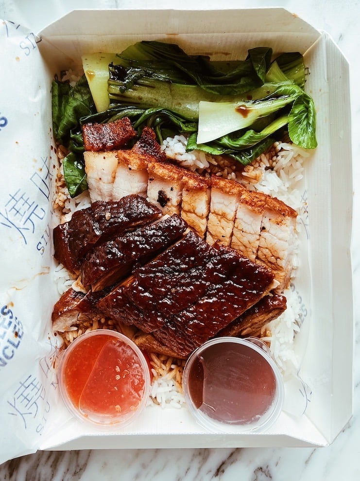 photo of three uncles cantonese bbq in white takeaway box