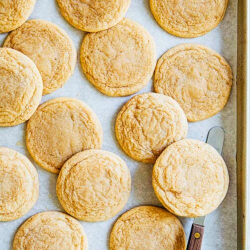 photo of maple sugar cookies on sheet pan with offset spatula