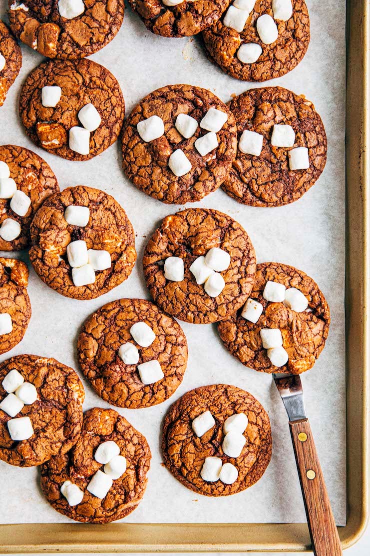photo of hot cocoa cookies with marshmallow on gold sheet pan