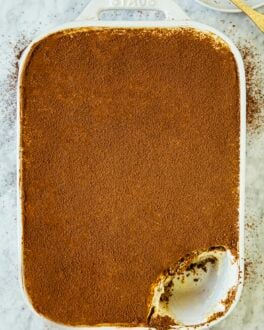 photo of classic tiramisu with a scoop removed