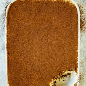 photo of classic tiramisu with a scoop removed