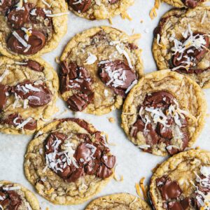 photo of coconut chocolate chip cookies on white parchment paper