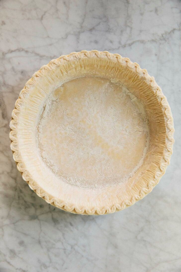 photo of frozen pie crust before it is prebaked for cream cheese pumpkin pie