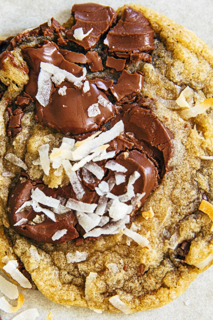 close up photo of coconut chocolate chip cookie showing shredded coconut on the chocolate feve