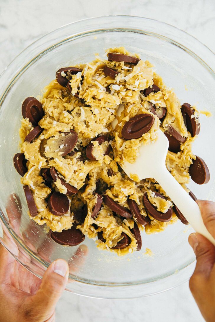 photo of coconut chocolate chip cookie dough before being scooped into cookie dough balls
