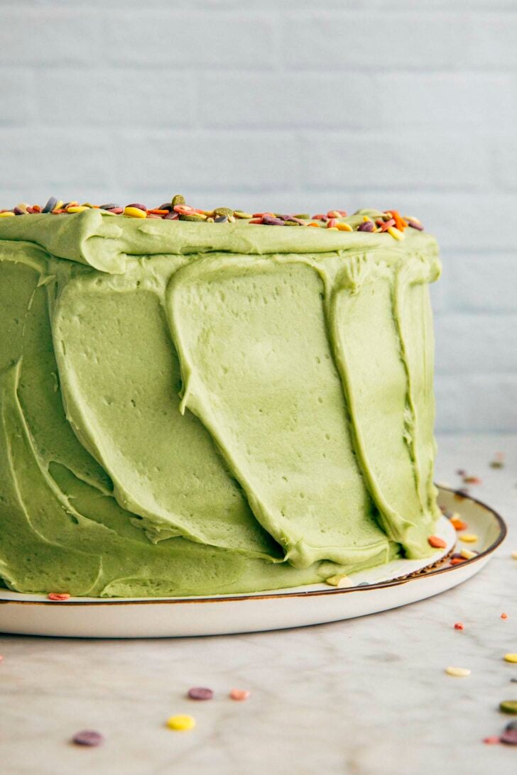 photo of the pistachio pudding layer cake showing the cake's frosted sides