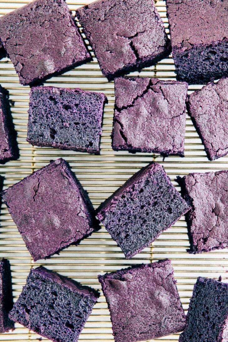 photo of ube mochi cake slices with some slices showing the crumb