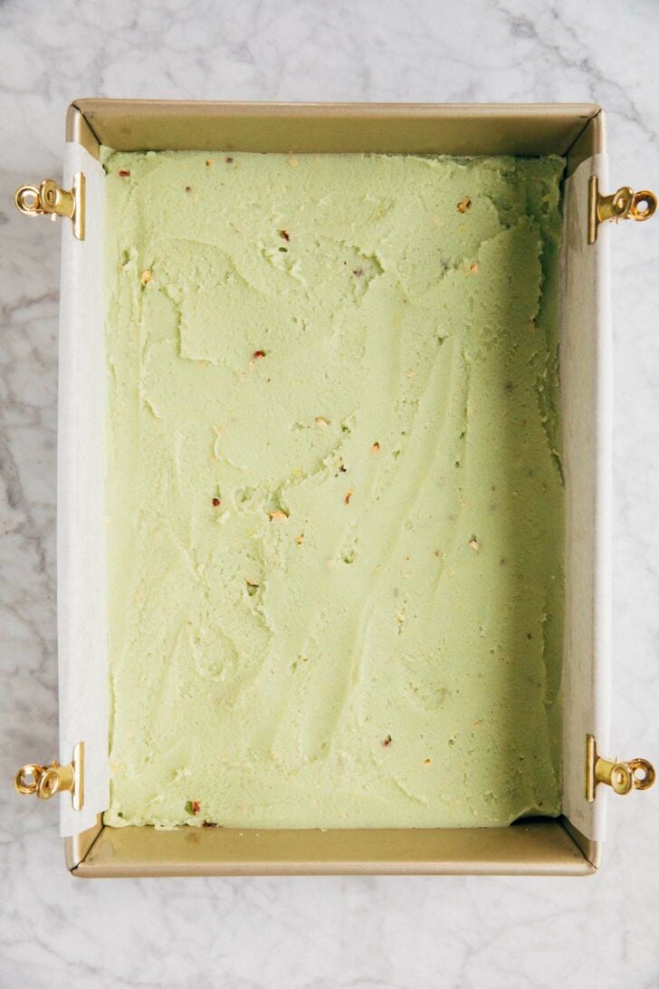 photo of pistachio pudding bar batter after it's been spread in the pan before it's been baked
