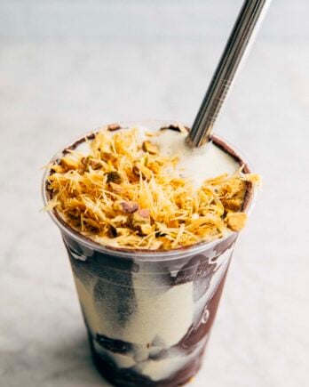 photo of copycat shake shack dubai chocolate shake with a metal straw