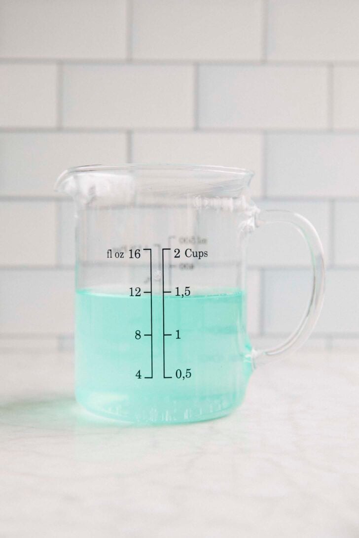 Photo of Mountain Dew Baja Blast in a liquid measuring cup before it has been reduced into a concentrate for the recipe