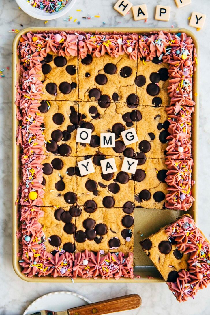 photo of rectangular chocolate chip cookie cake sliced into squares