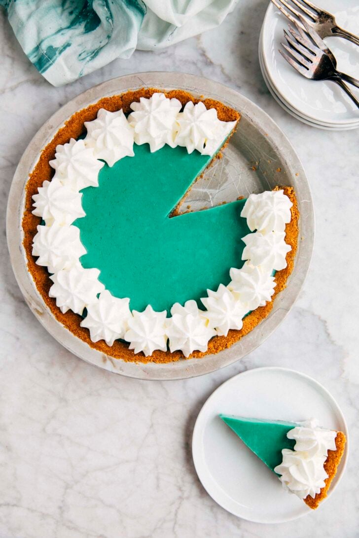 photo of homemade Baja Blast pie with a slice cut out of it and set on a small white plate next to it