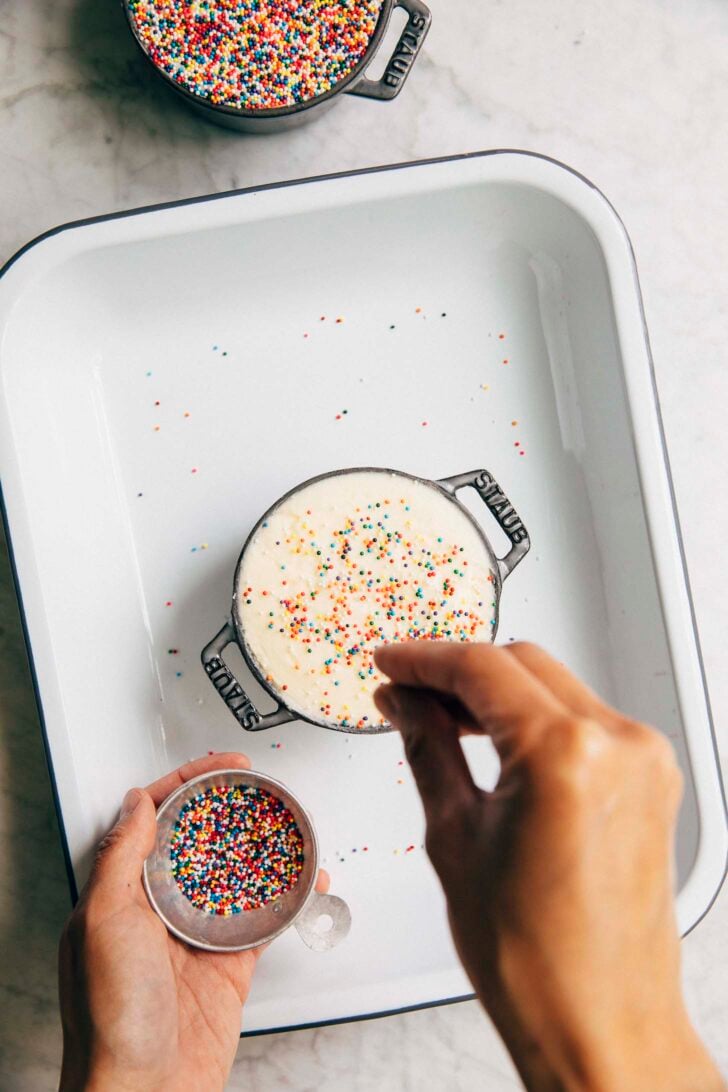 photo of michelle from hummingbird high decorating the dot cakes
