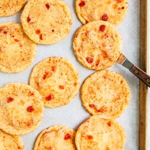 photo showing strawberry doodle cookies on sheet pan