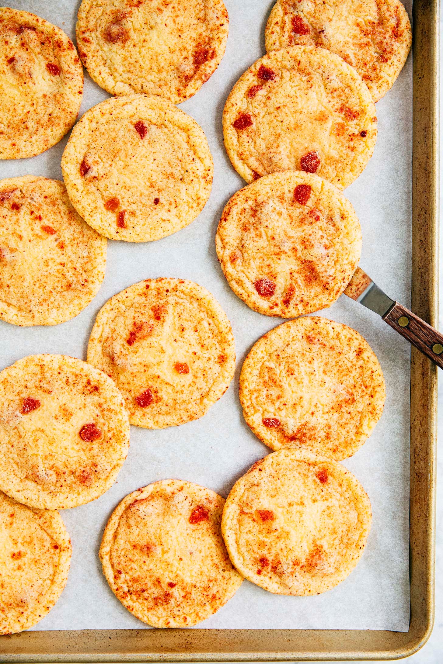 photo showing strawberry doodle cookies on sheet pan