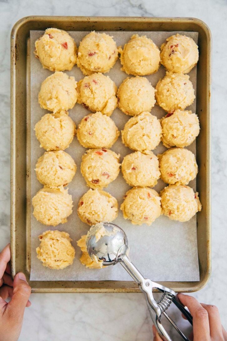 photo showing michelle from hummingbird high scooping the dough into cookie dough balls