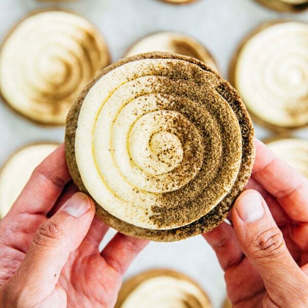 photo of michelle from hummingbird high holding up a hojicha einspanner cookie