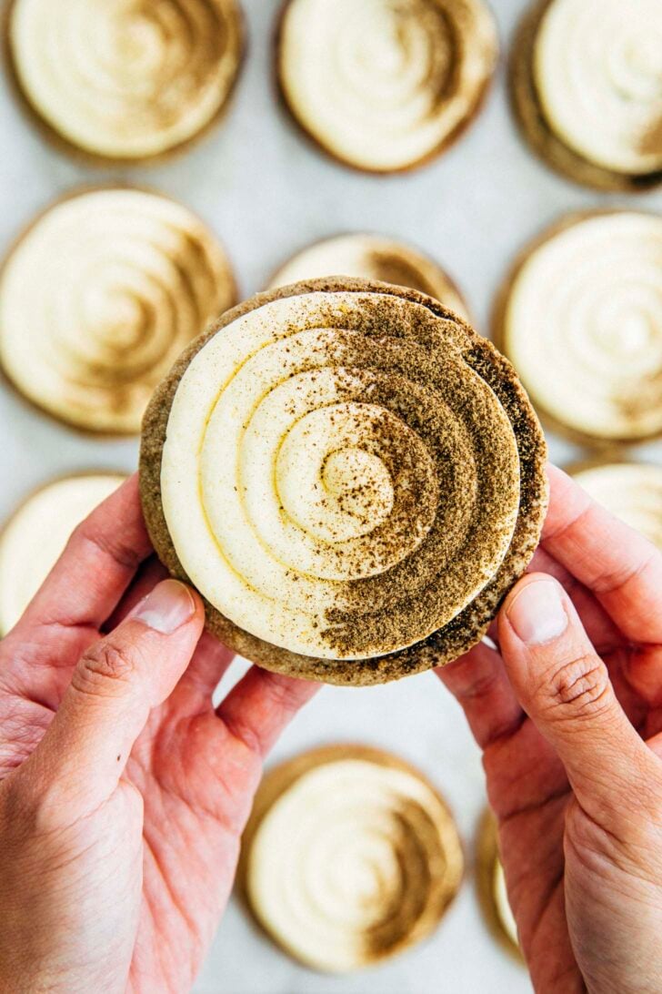 photo of michelle from hummingbird high holding up a hojicha einspanner cookie